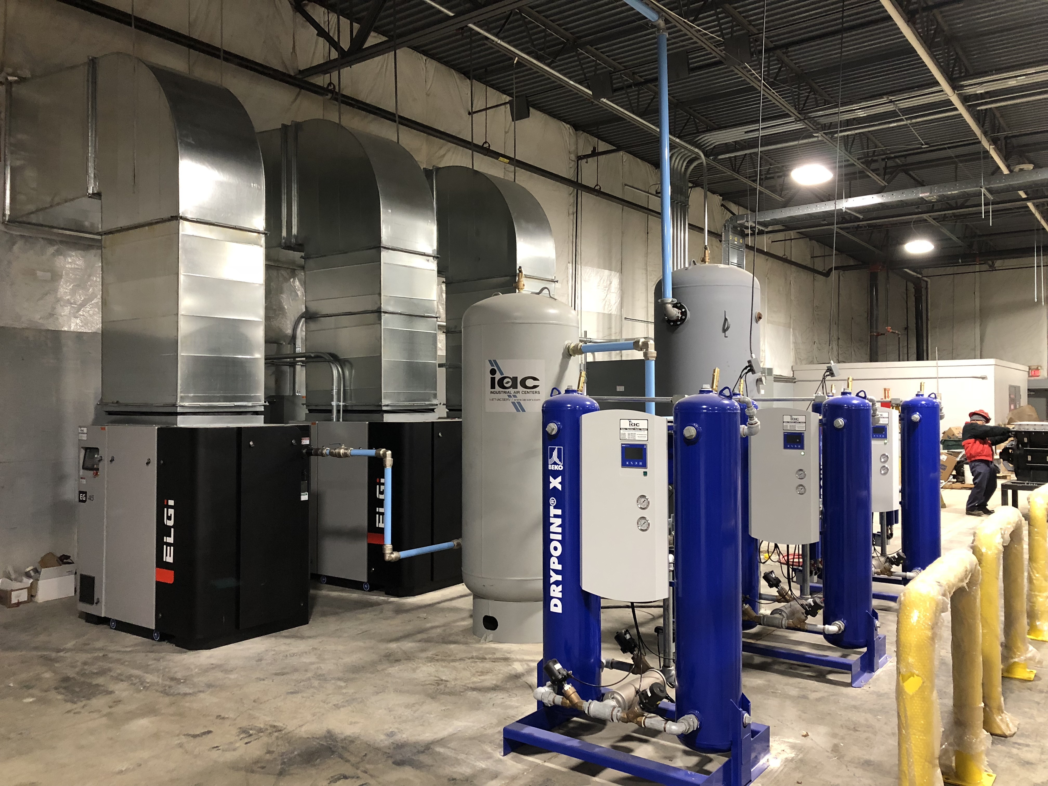 An IAC-installed compressed air system featuring ELGi compressors, Mikropor dryers, and air receivers, showcasing a complete CAS solution designed, installed, and maintained by IAC.